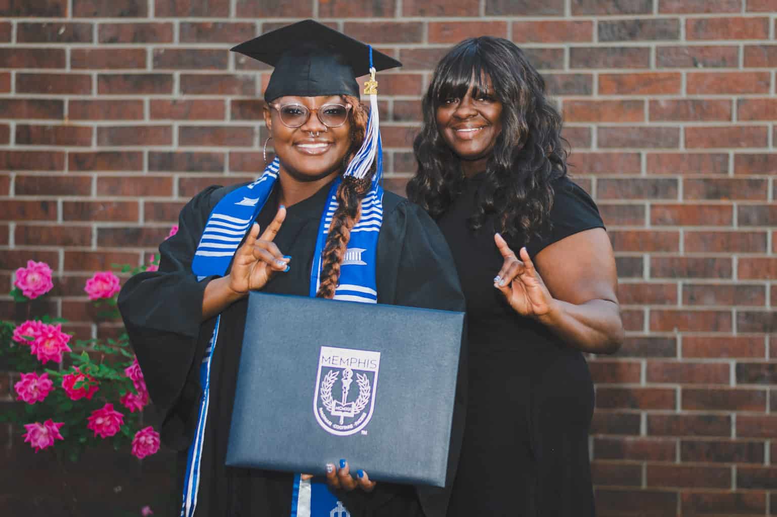 A photo of mother celebrating graduation with her daughter